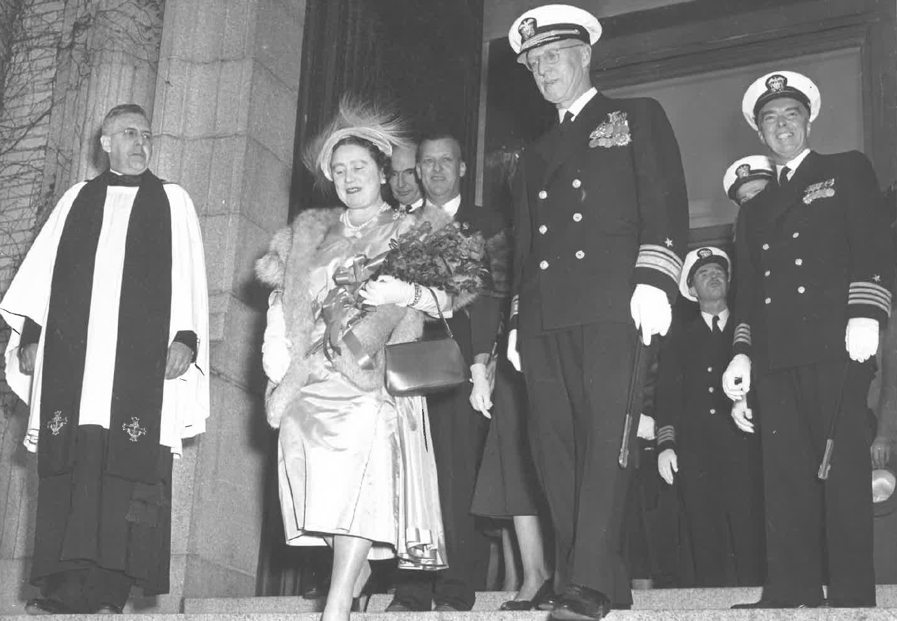 Rear Admiral Boon escorts the Queen Mother from the Naval Academy Chapel.