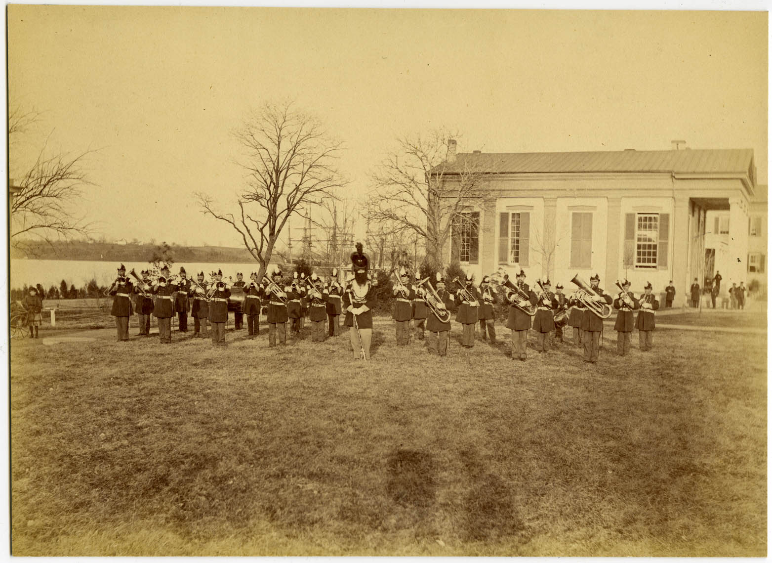 The Naval Academy Band in 1869. The bearded man front and center was the Drum Major Andrew Denver, referred to as "Old Denver."