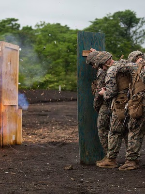 Marine combat engineer conducting explosive breaching