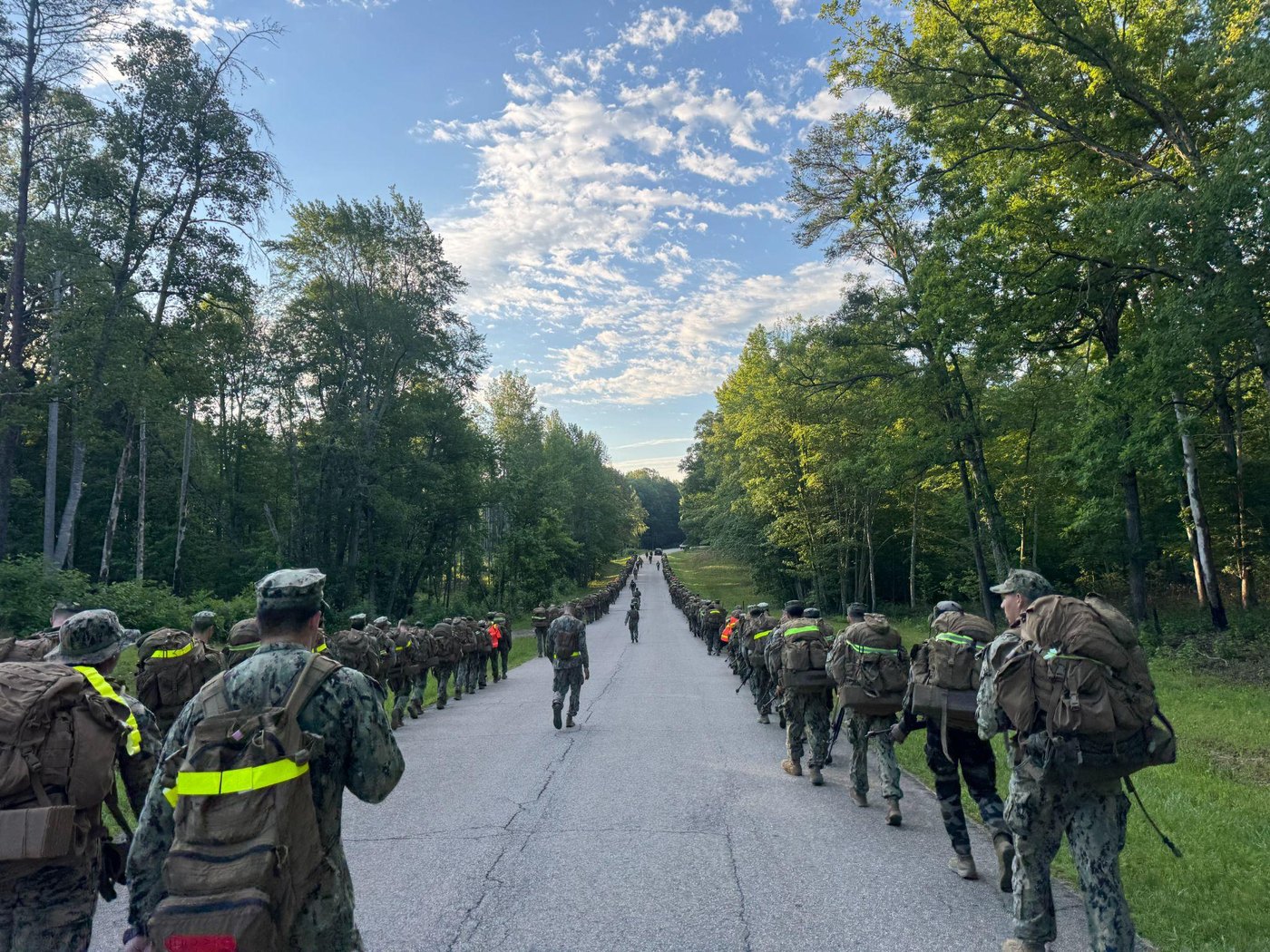 Midshipmen ruck march through the Quantico training area