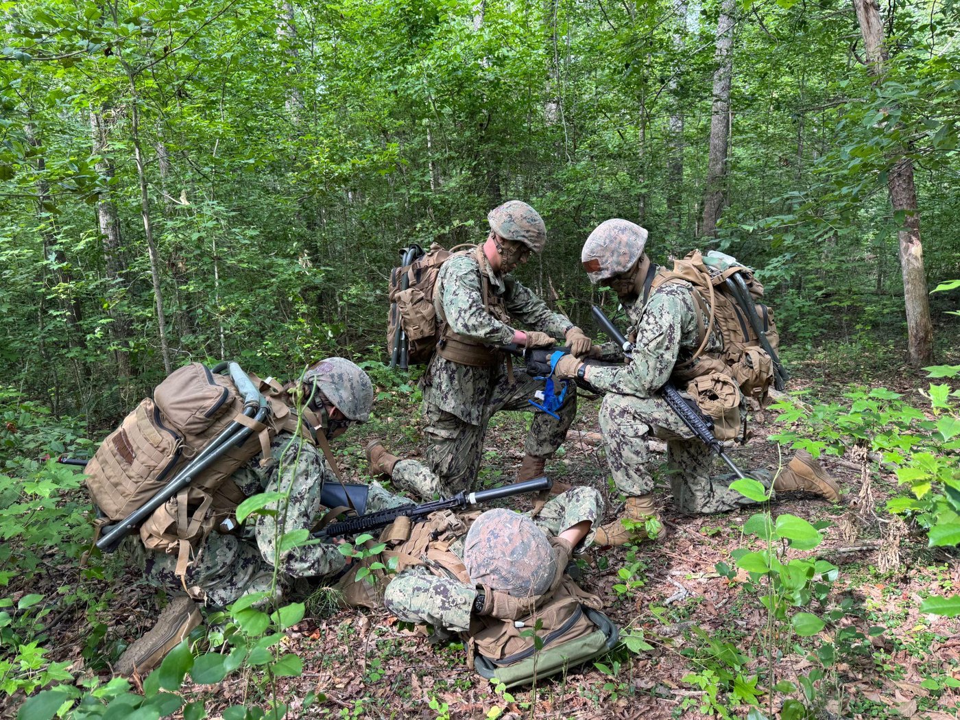Midshipmen practice tactical combat casualty care in the field