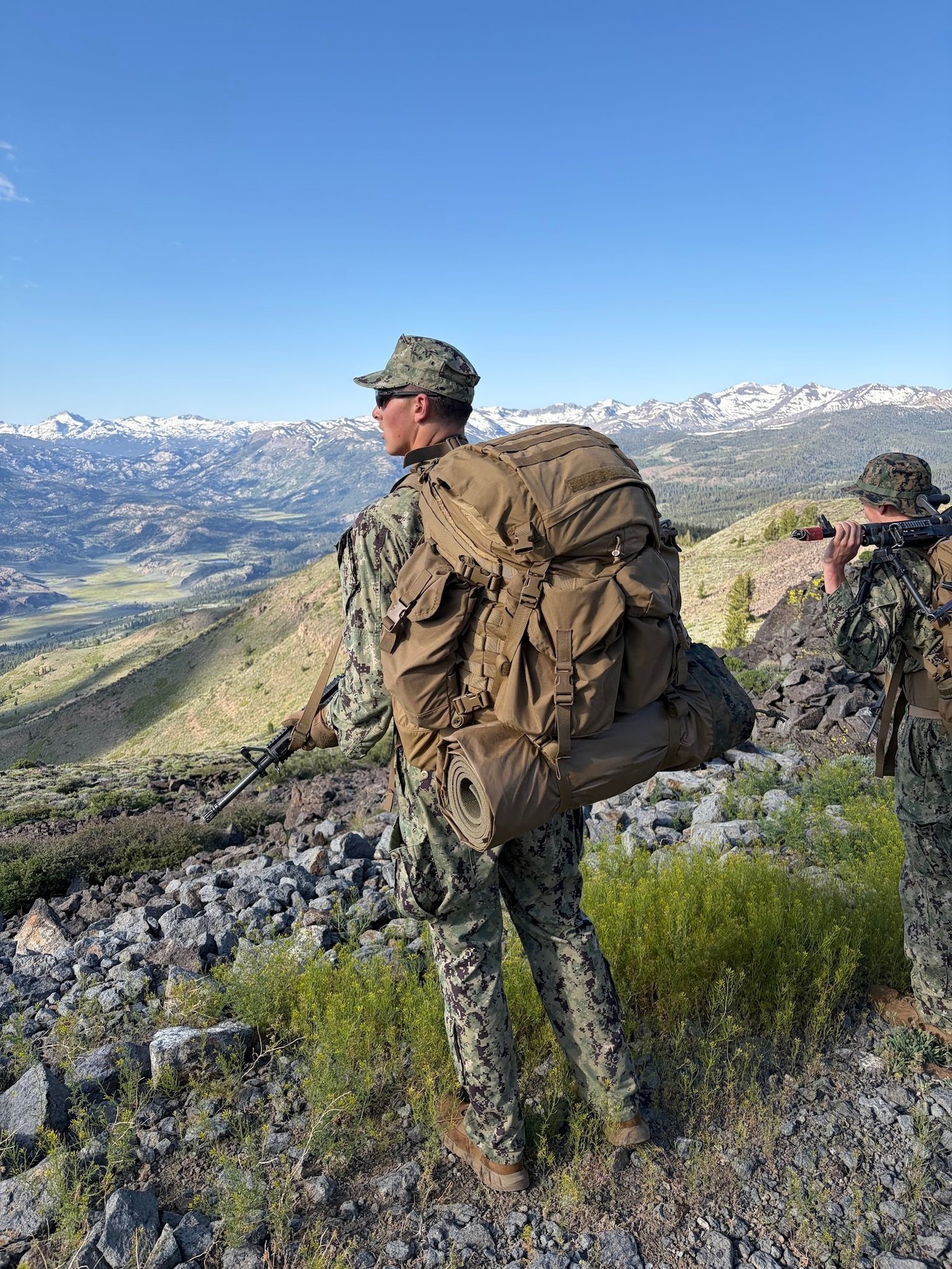 Midshipmen move through high-altitude terrain during MWTC
