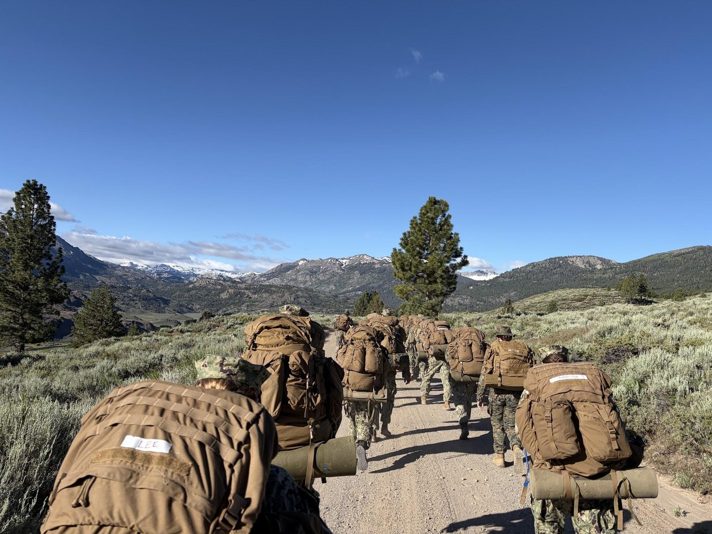 Midshipmen ruck through mountainous terrain during MWTC